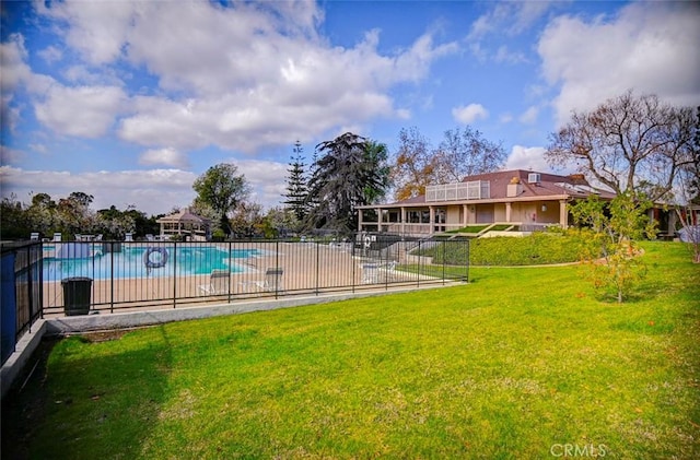 view of pool featuring a yard and a patio area