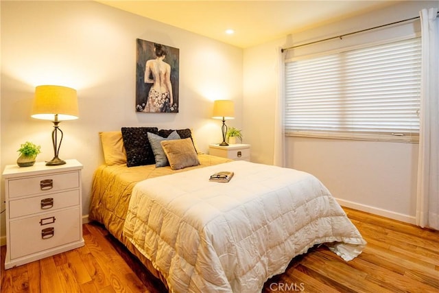 bedroom with light hardwood / wood-style floors