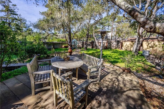 view of patio / terrace with a storage unit