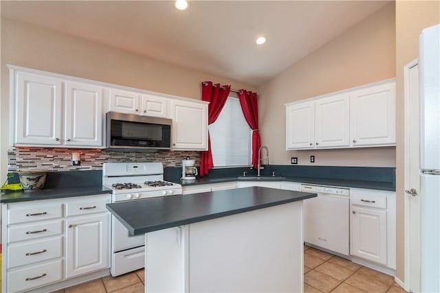 kitchen with a kitchen island, sink, white cabinets, and white appliances