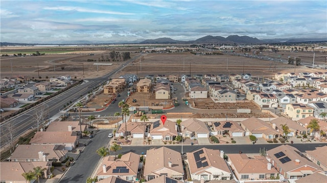 birds eye view of property featuring a mountain view