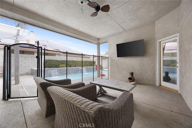 view of patio featuring ceiling fan