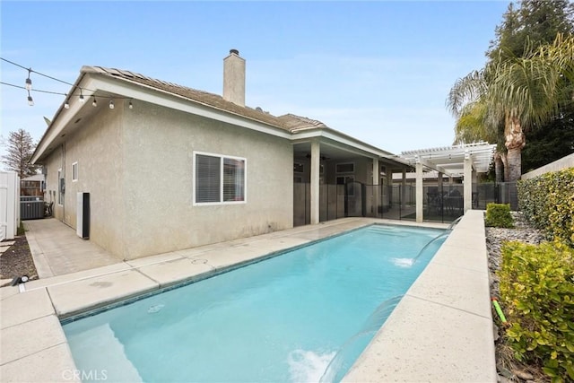 view of swimming pool featuring a pergola