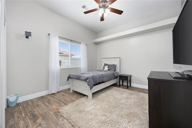 bedroom featuring hardwood / wood-style flooring and ceiling fan