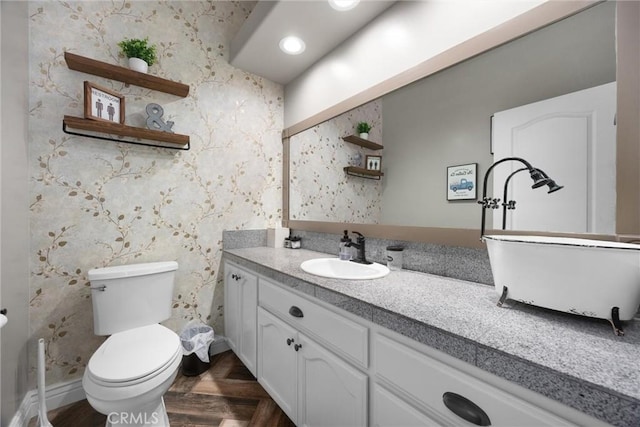 bathroom with vanity and toilet