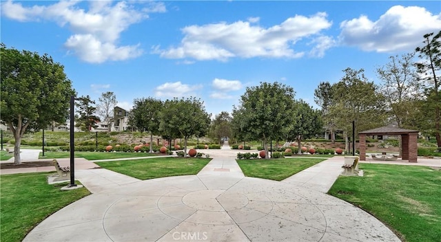 view of property's community featuring a yard and a gazebo