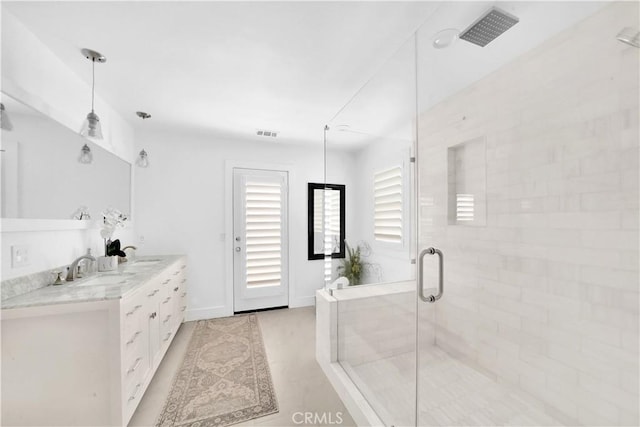 bathroom featuring vanity and walk in shower