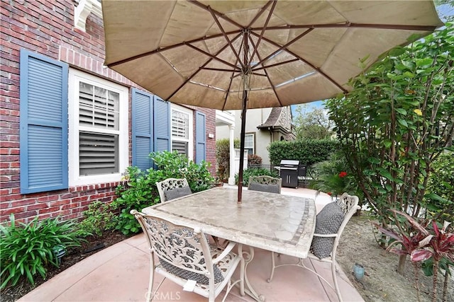 view of patio featuring a grill