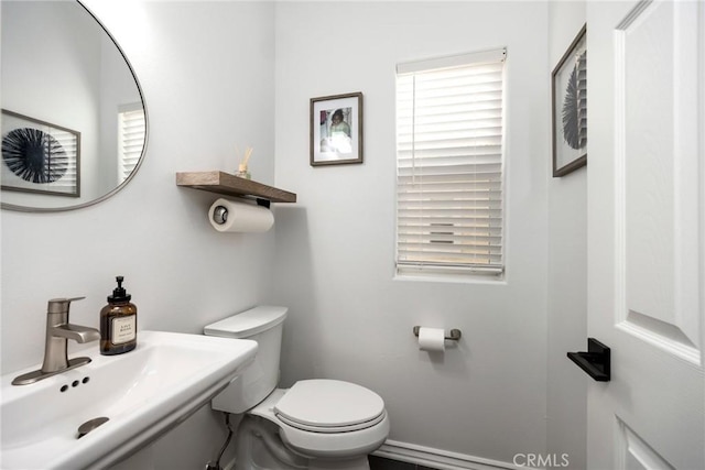 bathroom featuring sink and toilet