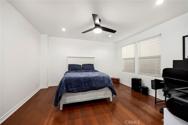 bedroom featuring ceiling fan and dark hardwood / wood-style flooring