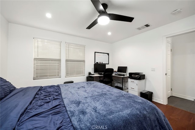 bedroom featuring ceiling fan and dark hardwood / wood-style flooring