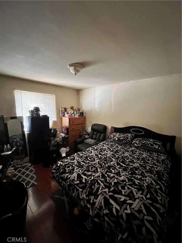 bedroom with wood-type flooring