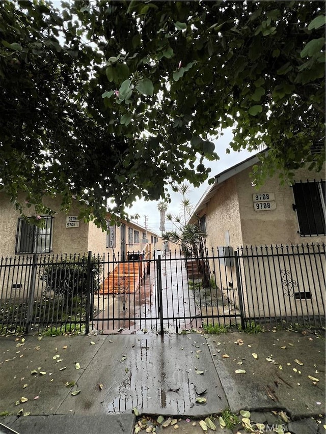 view of gate with fence