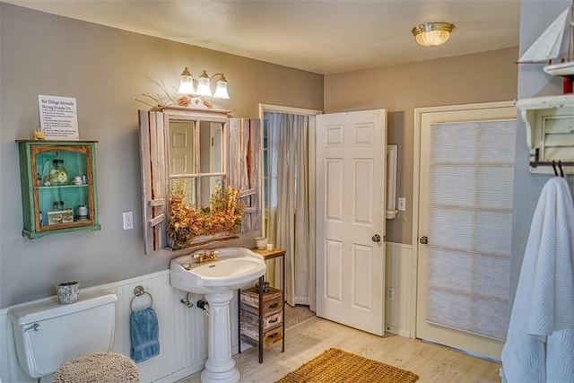 bathroom featuring hardwood / wood-style floors, sink, and toilet