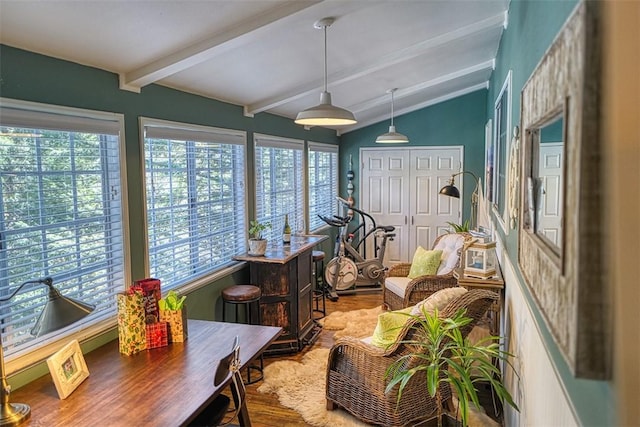 sunroom with lofted ceiling with beams