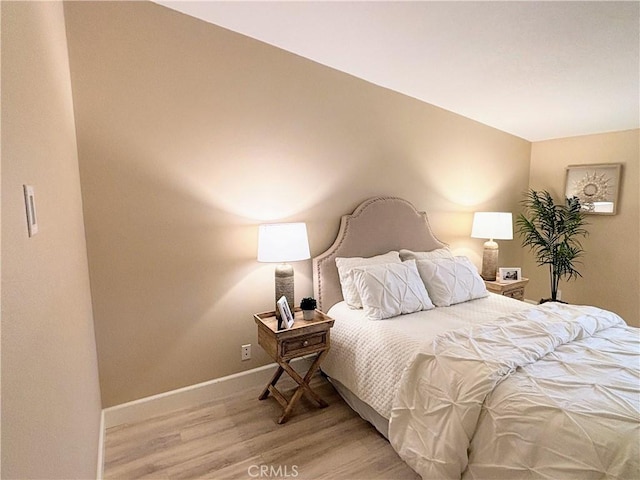 bedroom with light hardwood / wood-style floors