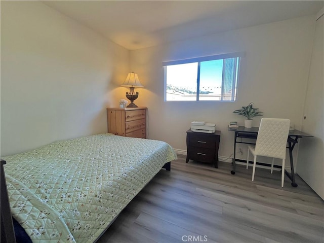 bedroom featuring wood-type flooring