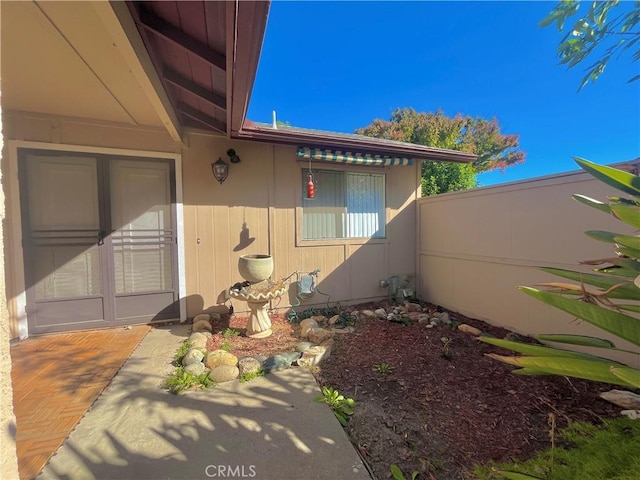 view of side of property with a patio