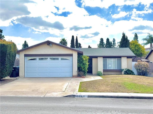 ranch-style house featuring a garage and a front yard