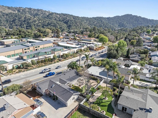 drone / aerial view with a residential view and a forest view