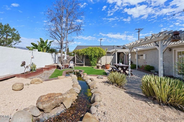 view of yard with a fenced backyard, a pergola, and a patio