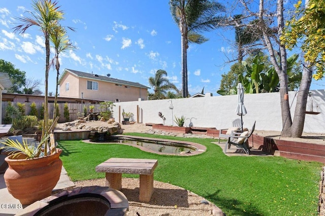 view of yard featuring a fenced backyard