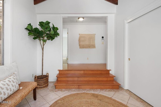 stairway featuring tile patterned flooring