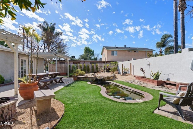 view of yard with a patio area, a fenced backyard, and a pergola