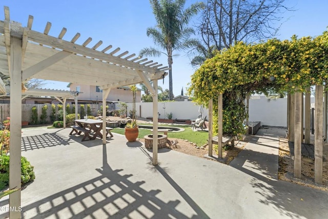 view of patio / terrace with outdoor dining space, a fenced backyard, and a pergola