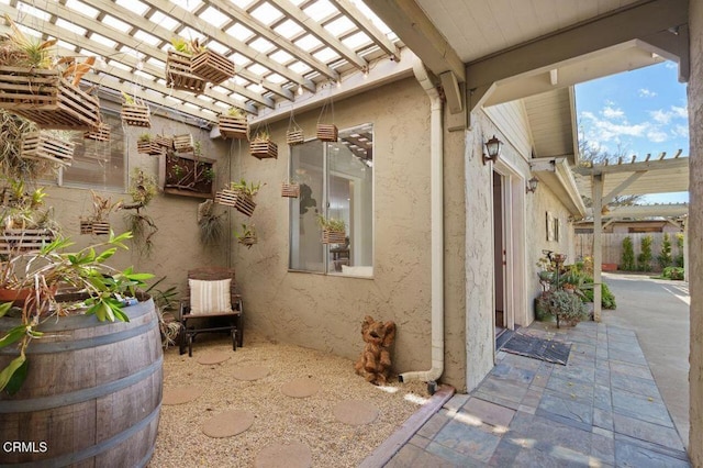 view of patio / terrace with fence and a pergola