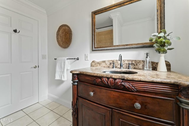 bathroom featuring baseboards, ornamental molding, vanity, and tile patterned floors