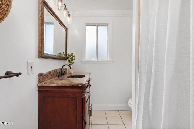 full bath with toilet, vanity, baseboards, ornamental molding, and tile patterned floors