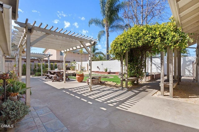 view of patio / terrace featuring a fenced backyard and a pergola