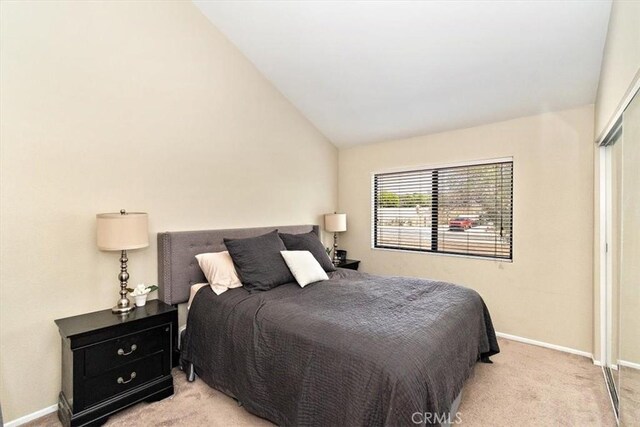 8556 Baldy Vista Dr, Rancho Cucamonga, CA 91730 - bedroom featuring lofted ceiling, baseboards, and carpet floors