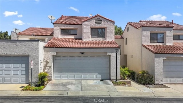 8556 Baldy Vista Dr, Rancho Cucamonga, CA 91730 - mediterranean / spanish house featuring a tile roof, driveway, and stucco siding