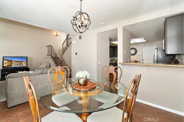 8556 Baldy Vista Dr, Rancho Cucamonga, CA 91730 - dining room with tile patterned flooring, visible vents, a chandelier, stairs, and baseboards