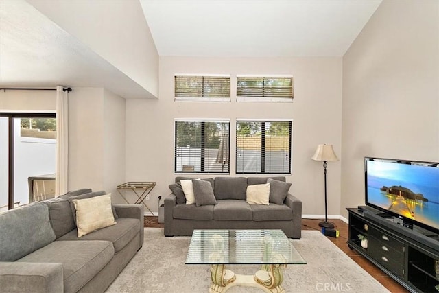 8556 Baldy Vista Dr, Rancho Cucamonga, CA 91730 - living area featuring a healthy amount of sunlight, wood finished floors, and baseboards