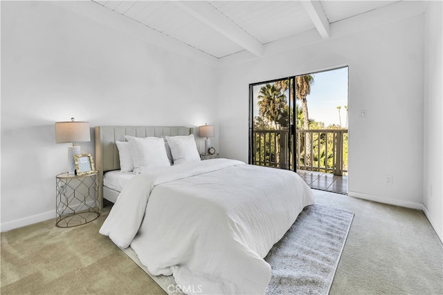 bedroom with beamed ceiling, light carpet, and access to outside