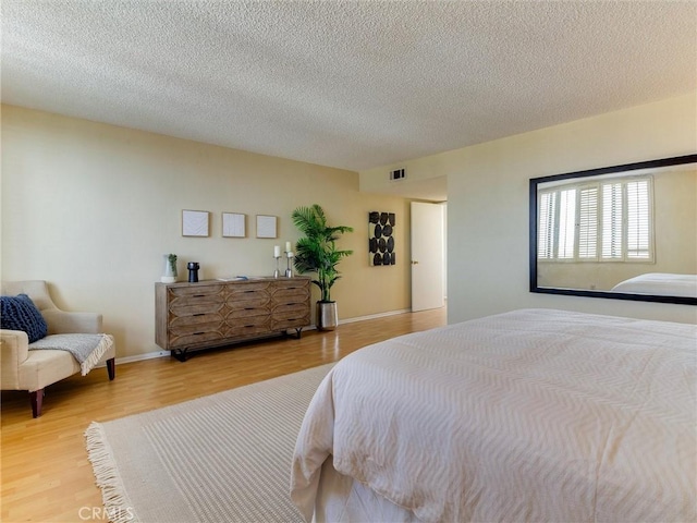 1923 Molino Ave Unit 303, Signal Hill, CA 90755 - bedroom featuring wood finished floors and a textured ceiling