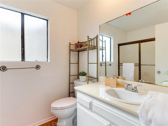 1923 Molino Ave Unit 303, Signal Hill, CA 90755 - full bathroom featuring toilet, vanity, a shower with door, and baseboards