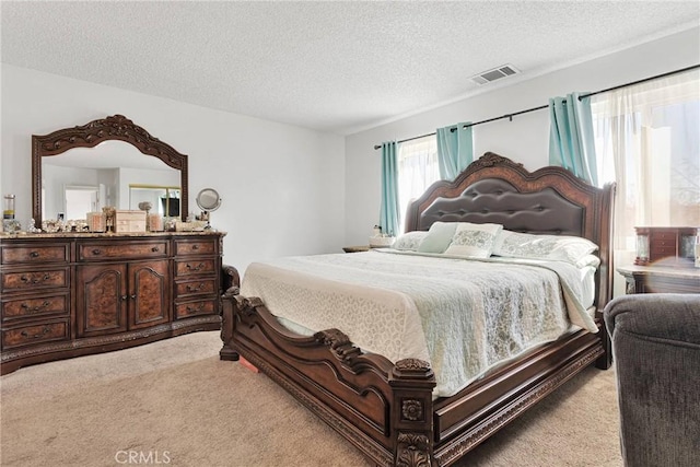 carpeted bedroom with a textured ceiling