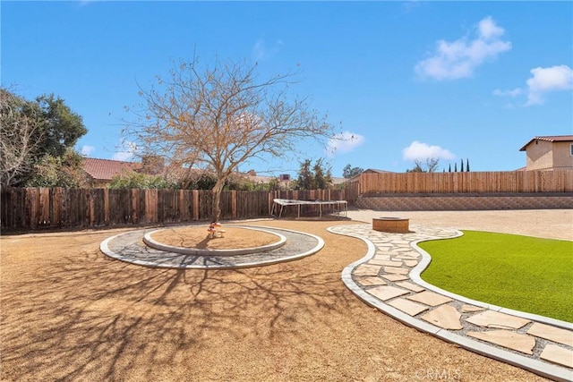 view of yard featuring a trampoline