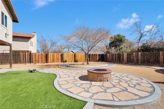 view of patio featuring a fire pit