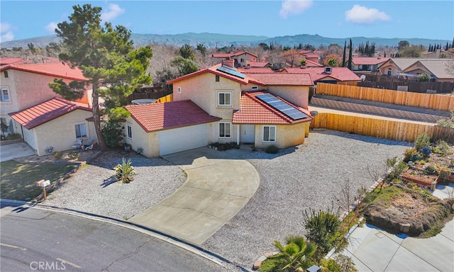 birds eye view of property with a mountain view