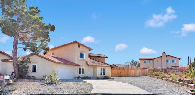 back of property with a garage