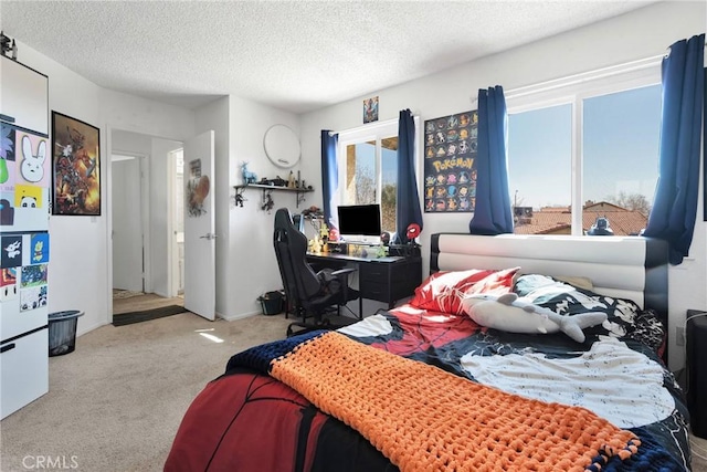 carpeted bedroom featuring a textured ceiling