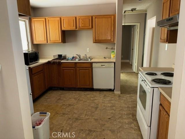 kitchen with sink and white appliances