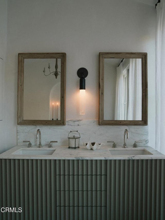 bathroom with tasteful backsplash and vanity