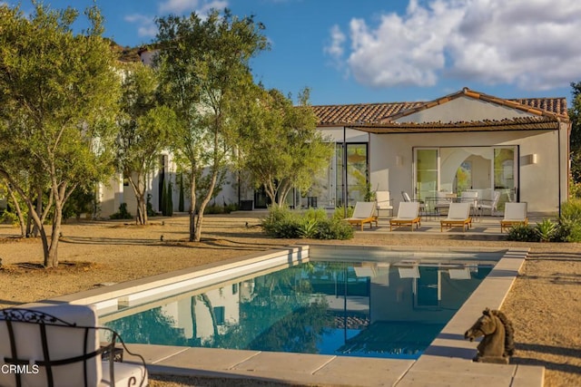 back of property featuring a patio