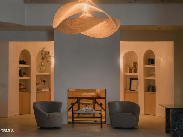 living area featuring built in shelves